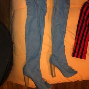 Thigh high demon block heel.